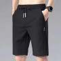 2022 Summer Men'S Sports Shorts Solid Color Straight Pattern Loose Type Elastic Waist Drawstring Casual Shorts Jogging Pants
